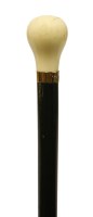 Lot 122 - An art deco ebony and ivory 'dress' walking stick