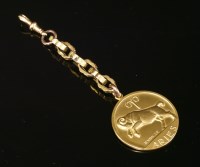Lot 238 - A 9ct gold Zodiac pendant by Alabaster and Wilson