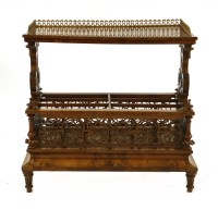 Lot 983 - A Victorian walnut canterbury whatnot