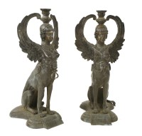 Lot 871 - A pair of bronze floor lamps