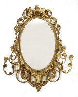 Lot 911 - A Continental gilded gesso girandole