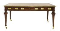 Lot 957 - A walnut bureau plat