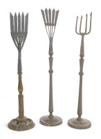 Lot 840 - Three wrought iron eel spears
