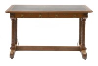 Lot 987 - A walnut library table in the manner of A W N Pugin