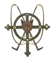 Lot 19 - A cast iron wall hanging whip stand