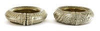 Lot 264 - A pair of Ashanti nickel(?) currency bangles