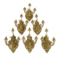Lot 995 - Six three-branch gilt metal wall lights