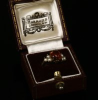 Lot 15 - A 9ct gold amber cabochon ring