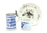 Lot 384 - A tin glazed tankard with a pewter mount inscribed IB 1762