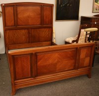 Lot 553 - An Art Nouveau walnut and mahogany double bed