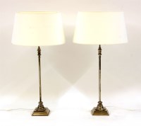 Lot 408 - A pair of slender silvered table lamps