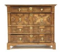 Lot 687 - A Charles II oak chest of four geometrically moulded drawers