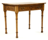 Lot 686 - An oak single drawer writing table