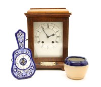 Lot 373 - An early 20th century walnut mantel clock