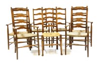 Lot 699 - A harlequin set of 19th century rush seated ladder back elbow chairs