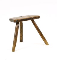 Lot 596 - An 18th century elm milking stool