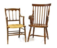 Lot 583 - A 19th century stick back elbow chair and one other similar
