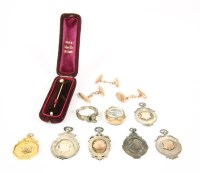 Lot 24 - A 9ct gold medallion with engraved inscription verso