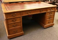 Lot 729 - An oak nine drawer pedestal desk
