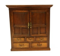 Lot 617 - An oak cupboard