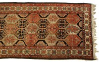 Lot 724 - A large Caucasian rug