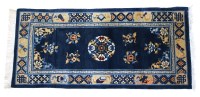 Lot 537 - A Chinese blue ground rug