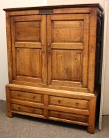 Lot 646 - An early 18th century oak linen press