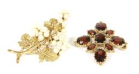 Lot 13 - A 9ct gold oval cut garnet cluster brooch