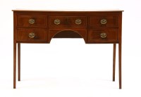 Lot 711 - A small George III strung mahogany kneehole sideboard