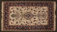 Lot 525 - An ivory ground machine made Persian style rug