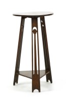 Lot 613 - An Arts and Crafts oak lamp table
