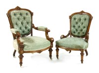 Lot 567 - A pair of Victorian walnut and carved lady's and gentleman's chairs