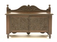 Lot 585 - A small oak cabinet