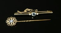 Lot 45G - A three stone aquamarine and diamond bar brooch