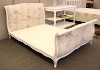 Lot 624 - A French style white painted and florally upholstered double bed