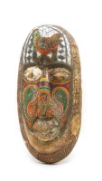 Lot 420 - A North African carved tribal mask with beadwork detail