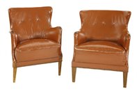 Lot 68 - A pair of brown leather chairs