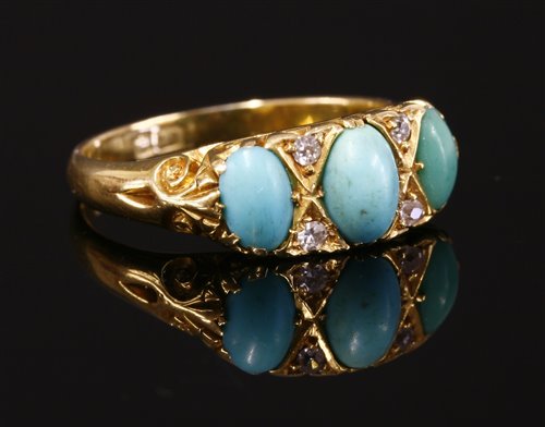Lot 64 - An 18ct gold turquoise and diamond carved head ring, c.1900