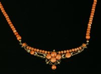 Lot 126 - An Edwardian coral and simulated pearl necklace
