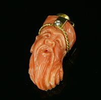 Lot 260 - A gold coral and diamond pendant