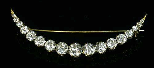 Lot 40 - A late Victorian diamond set crescent brooch