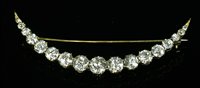Lot 40 - A late Victorian diamond set crescent brooch