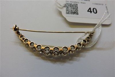 Lot 40 - A late Victorian diamond set crescent brooch