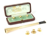 Lot 105 - A cased 9ct gold cigarette holder