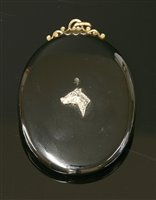 Lot 69 - A Victorian gold oval onyx glazed pendant/brooch picture locket