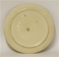 Lot 23 - A Minton's Art Pottery Studio charger depicting female portrait