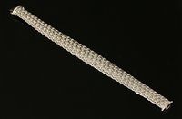 Lot 300 - A white gold graduated Bismark bracelet