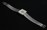 Lot 303 - A ladies white gold diamond set Zenith mechanical bracelet watch
