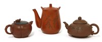 Lot 495 - A collection of three Yixing teapots