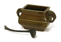 Lot 185 - A Chinese bronze water dropper and ladle